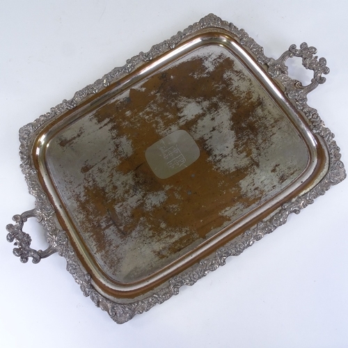 285 - A mid-19th century Sheffield plate tea tray, with armorial crest and cast surround, length excluding... 