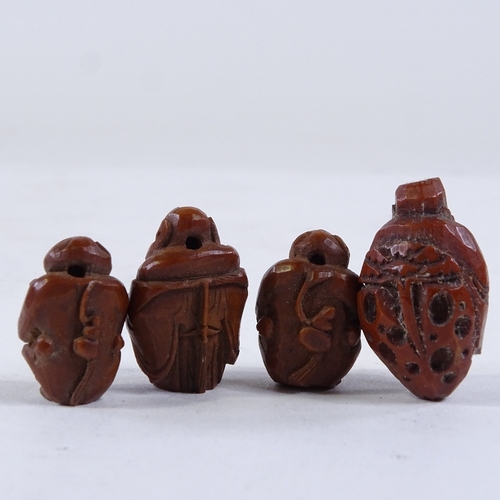 286 - A group of Japanese carved nut beads, and 2 larger relief carved nuts