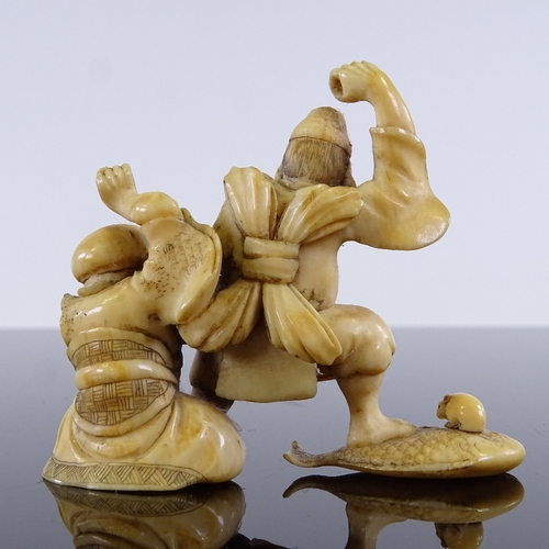 295 - A Japanese carved ivory okimono depicting 2 fishermen, height 5cm