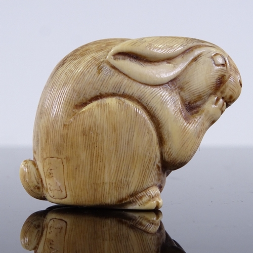 297 - A Japanese carved ivory hare netsuke, Meiji Period, height 3cm