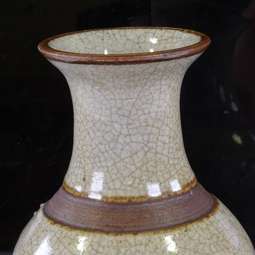 324 - A Chinese brown crackle glaze vase with relief prunus design, height 25cm