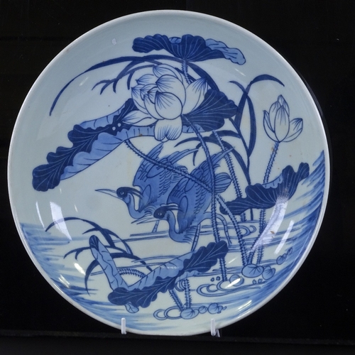 326 - A Chinese blue and white porcelain bowl, with painted design of herons, diameter 29cm