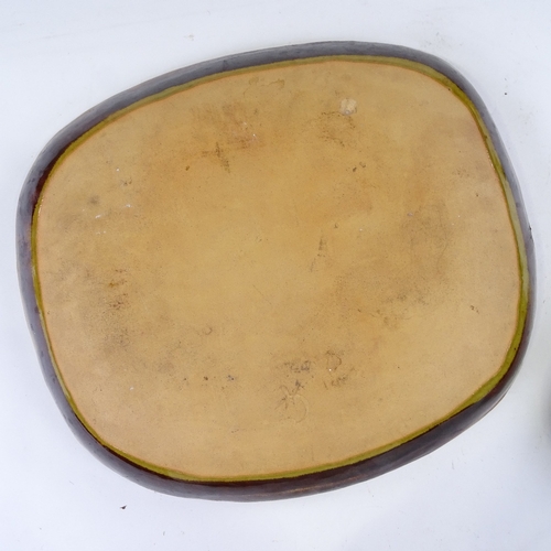 361 - A Continental treacle glaze pottery fish design plate, length 33cm, and a similar flask (2)