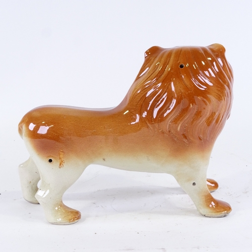 376 - A Staffordshire Pottery lion, length 33cm