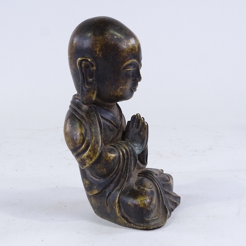 388 - A Chinese bronze seated Buddha, height 20cm