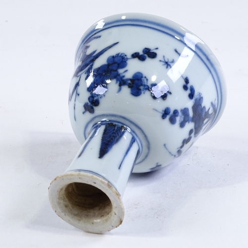 57 - A Chinese blue and white porcelain stem cup, hand painted bird and blossom design and relief moulded... 