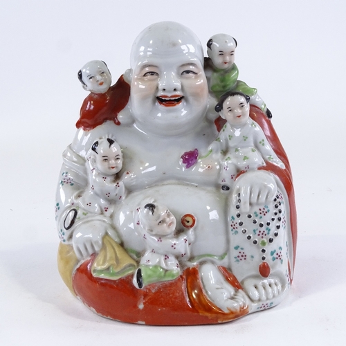 63 - A Chinese porcelain Buddha with children, height 20cm