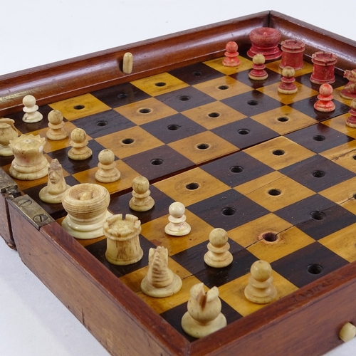 64 - A Jaques of London mahogany travelling chess set, mahogany-cased with rosewood and boxwood board, an... 