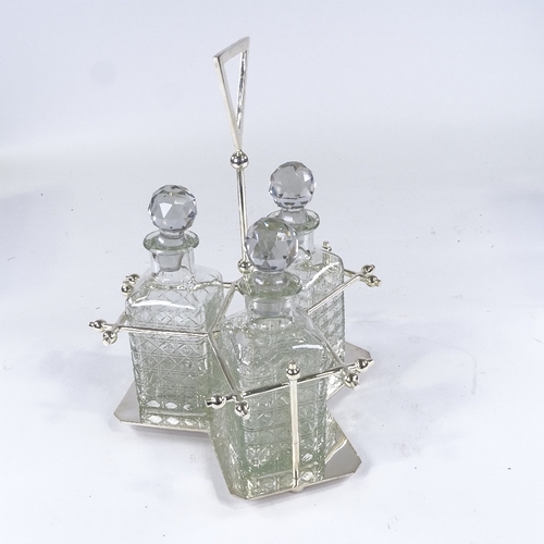 73 - A set of 3 square cut-glass decanters on Aesthetic style electroplate stand, probably mid-20th centu... 