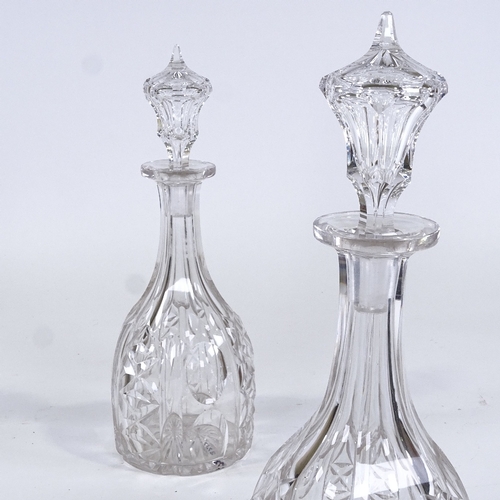 77 - A pair of cut-glass mallet-shaped decanters, height 34cm