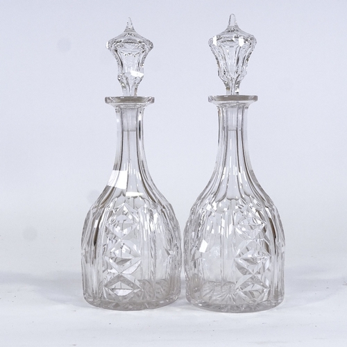 77 - A pair of cut-glass mallet-shaped decanters, height 34cm