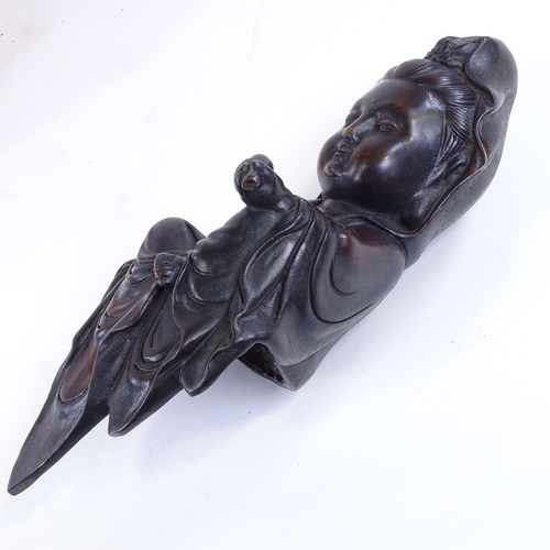 78 - A Chinese patinated bronze seated figure, height 29cm