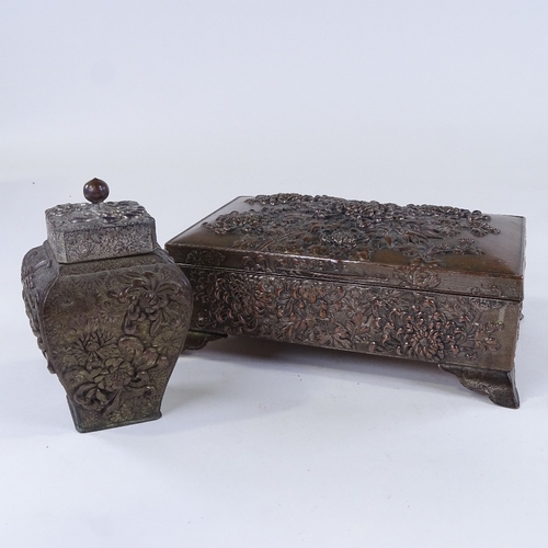 80 - A Chinese antimony box with relief moulded chrysanthemum designs, length 24cm, and a similar antimon... 