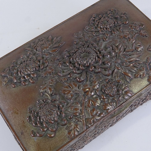 80 - A Chinese antimony box with relief moulded chrysanthemum designs, length 24cm, and a similar antimon... 