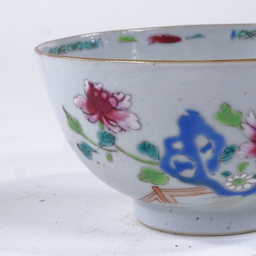 84 - A Chinese 18th century porcelain bowl with painted enamel flowers, diameter 11cm