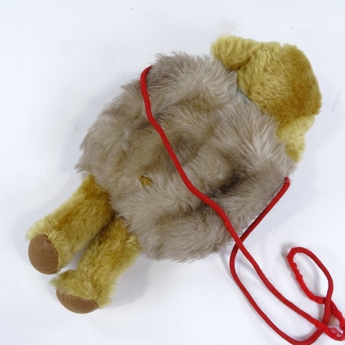 91 - A Merrythought Cheeky Bear hand warmer, with bell inside and original label, length 32cm