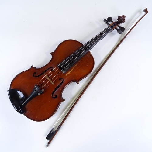 96 - A silver-mounted violin bow, by Adam Heinrich, together with an unnamed early 20th century violin, w... 