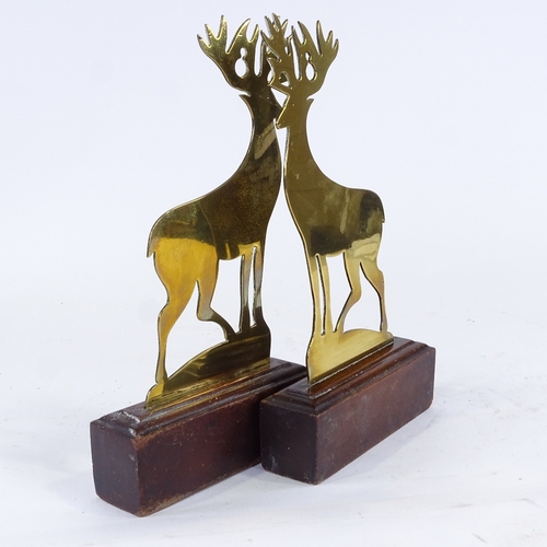 405 - A pair of Victorian brass stag design doorstops on wooden plinth bases, height 33cm