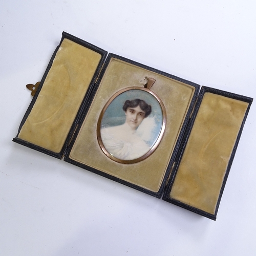 424 - A miniature watercolour on ivory, portrait of a lady, unsigned, in gilt-metal frame, leather-cased