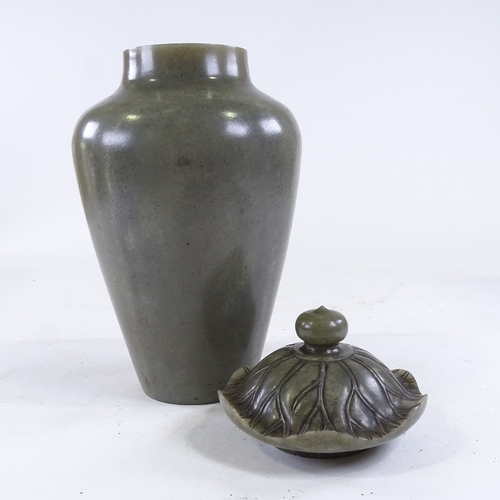 436 - A Chinese polished hardstone jar and cover, with carved cabbage leaf design lid, height 35cm