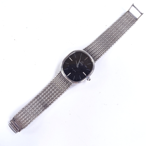 484 - OMEGA - a Vintage sterling silver Deville mechanical wristwatch, black oval dial with baton hour mar... 