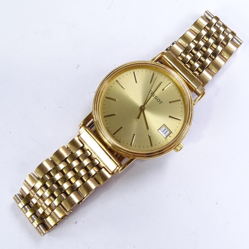 508 - TISSOT - a Vintage gold plated stainless steel quartz wristwatch, ref. C282K, champagne dial with gi... 