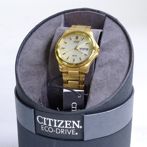 522 - CITIZEN - a gold plated stainless steel Eco-Drive WR50 quartz wristwatch, ref. E101-8034957, silvere... 