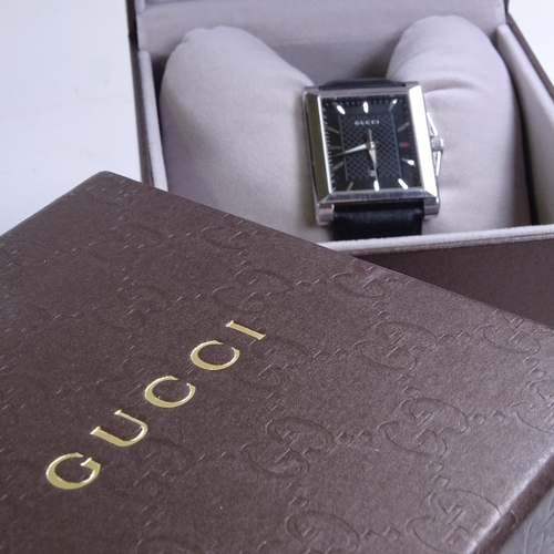 525 - GUCCI - a stainless steel G-Timeless Rectangle quartz wristwatch, circa 2015, ref. 138.4, black dial... 