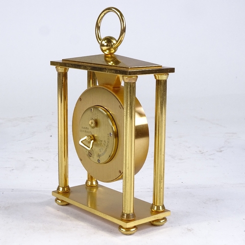 540 - BUCHERER - a Vintage brass-cased 4-pillar 8-day mantel clock, silvered dial with Roman numeral hour ... 