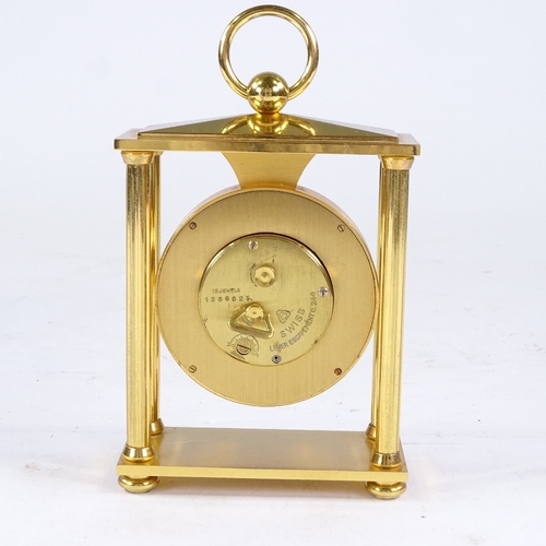 540 - BUCHERER - a Vintage brass-cased 4-pillar 8-day mantel clock, silvered dial with Roman numeral hour ... 