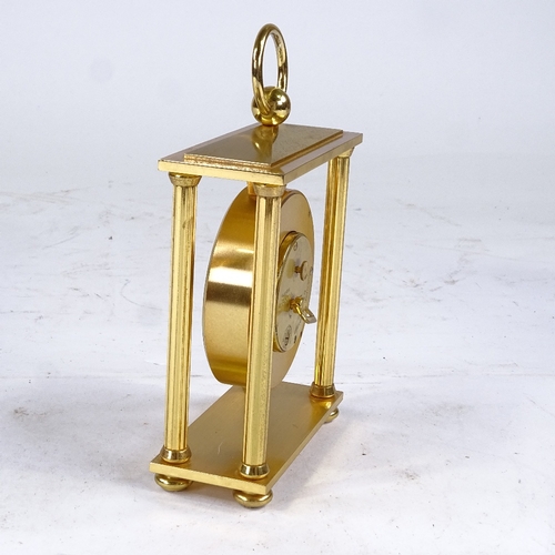 540 - BUCHERER - a Vintage brass-cased 4-pillar 8-day mantel clock, silvered dial with Roman numeral hour ... 