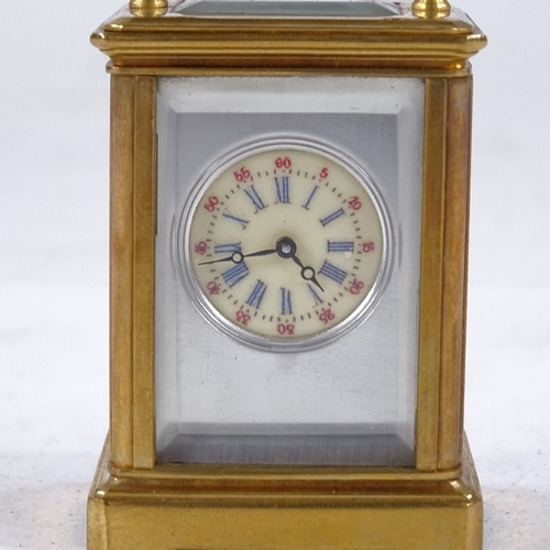 541 - A miniature brass-cased carriage clock, printed dial with Roman numeral hour markers and silvered su... 