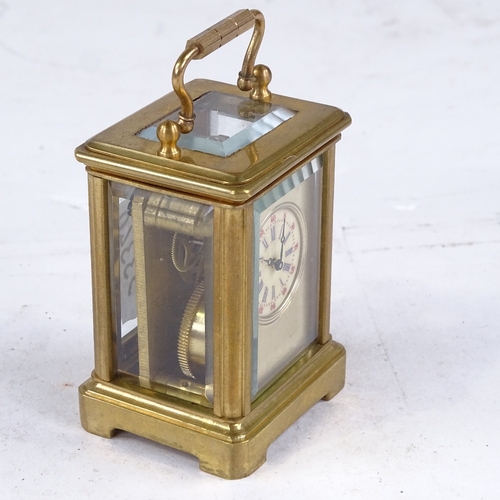 544 - A miniature brass-cased carriage clock, printed dial with Roman numeral hour markers and silvered su... 