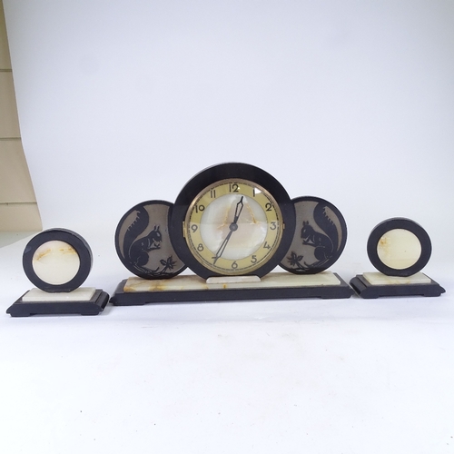 550 - An Art Deco green onyx and slate 8-day 3-piece clock garniture, circular panels with brass chapter r... 