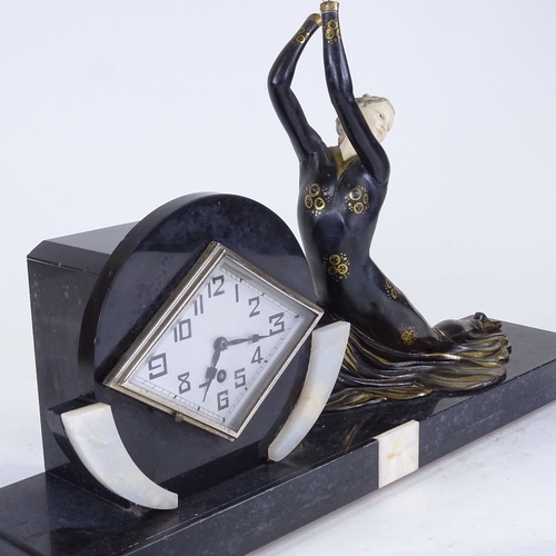 551 - An Art Deco slate and white onyx 30-hour mantel clock, silver diamond-shaped dial with Arabic numera... 