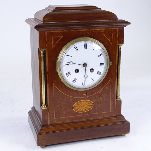 552 - An early 20th century French mahogany-cased 8-day mantel clock, white enamel dial with Roman numeral... 