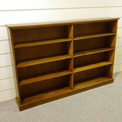 116 - A solid oak double-fronted open library bookcase, length 183cm (6'), height 122cm (4')