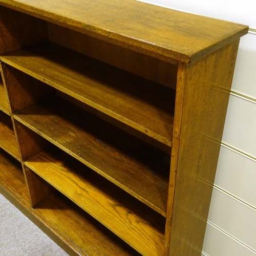 116 - A solid oak double-fronted open library bookcase, length 183cm (6'), height 122cm (4')