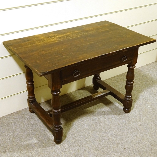 159 - A Georgian stained pine refectory style kitchen table, with turned supports, and single frieze drawe... 