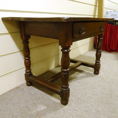 159 - A Georgian stained pine refectory style kitchen table, with turned supports, and single frieze drawe... 