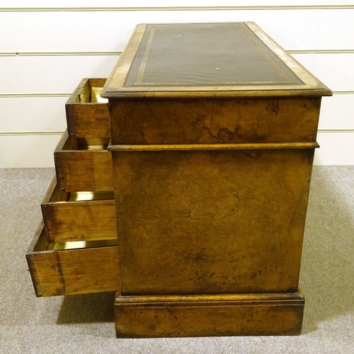 192 - A Victorian walnut pedestal desk of small size, with inset green leather top, and drawer fitted pede... 