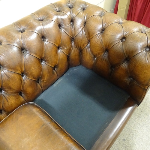 301 - A brown buttoned leather upholstered Chesterfield sofa, length 2m