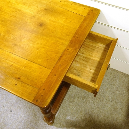 302 - A large cherrywood refectory style farmhouse table, 2cm thick plank-top, with turned supports, end f... 