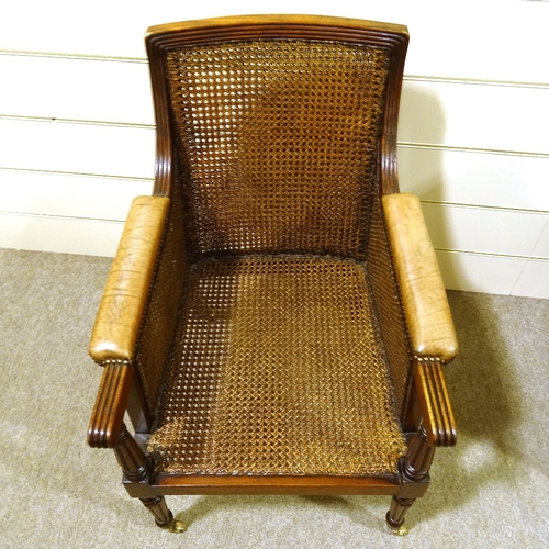 444 - A pair of 19th century Gillows style mahogany-framed bergere library chairs, with double-cane panels... 