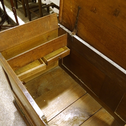 463 - An 18th century panelled oak mule chest, with 2 drawers under, width 115cm