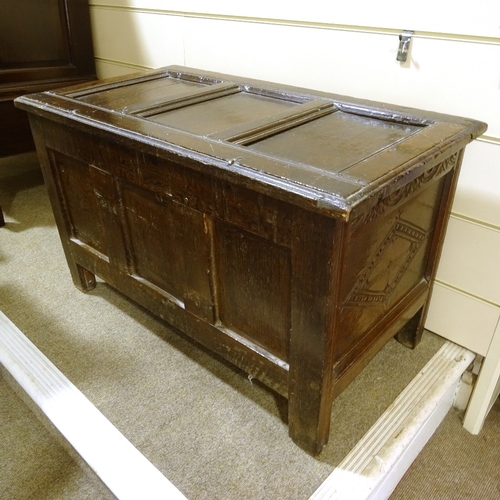 464 - 17th century panelled oak coffer, with lozenge carved 3-panel front, width 1m