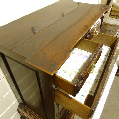 465 - An 18th century oak chest on stand, with carved shaped pediment, 2 short shaped frieze drawers and d... 