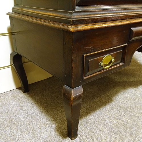 465 - An 18th century oak chest on stand, with carved shaped pediment, 2 short shaped frieze drawers and d... 