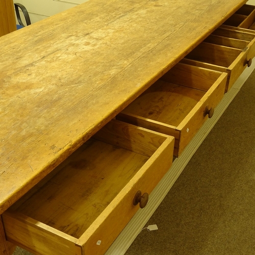 69 - A large 19th century pine farmhouse table, 3cm thick plank-top with frieze drawers and tapered legs,... 