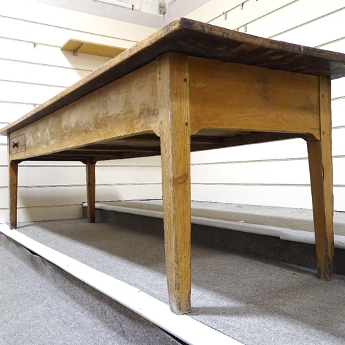 69 - A large 19th century pine farmhouse table, 3cm thick plank-top with frieze drawers and tapered legs,... 